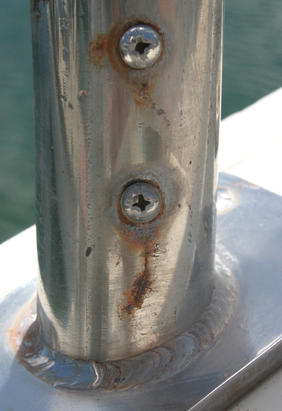 Crevice corrosion cracks around screw holes on stanchion